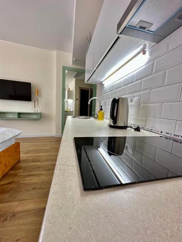 a kitchen with a sink and a counter top at Nina apartment in Batumi