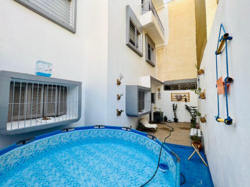 a swimming pool in the middle of a house at sweet house fes in Fez