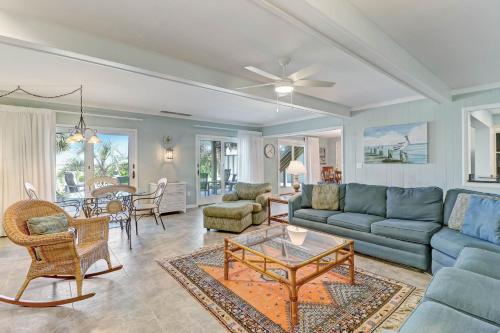 a living room with a couch and a table at Dog Friendly Beach House in Fernandina Beach