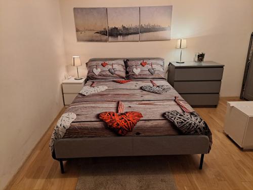 a bedroom with a bed with two hearts on it at Residenza Marvasi 10 in Caserta