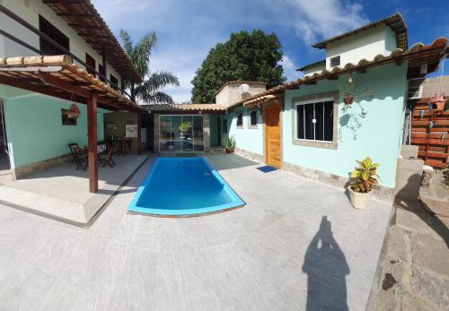 a patio with a swimming pool in a house at ROUTE 333 in Miguel Pereira