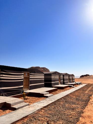 a row of barracks in the desert at Wadi Rum Sand Camp in Disah