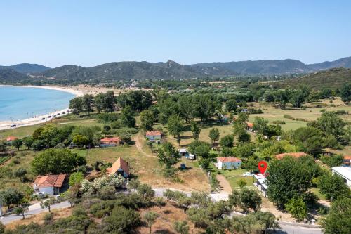 an aerial view of a beach and houses at Morfo Luxury Living in Sikia