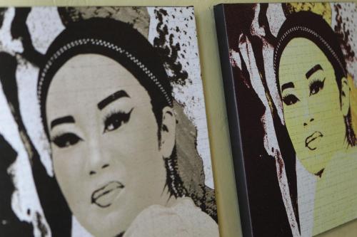 a book with a picture of a woman at Coffee Atelier in George Town