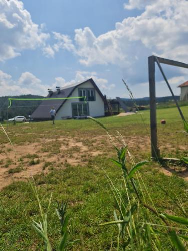 a man is playing a game of volley ball in a field at Sarajevo NATURE Romanija in Sarajevo