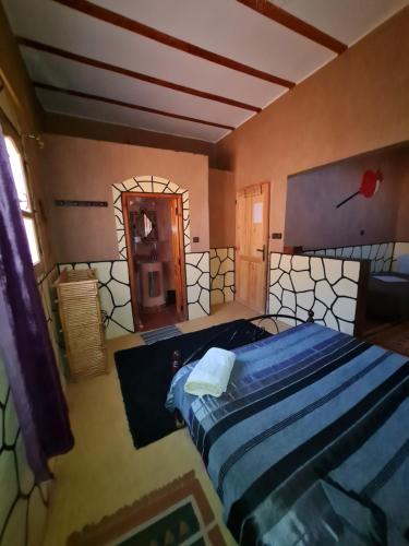 Postel nebo postele na pokoji v ubytování Riad Tigmi du Soleil