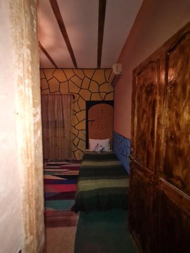 Postel nebo postele na pokoji v ubytování Riad Tigmi du Soleil