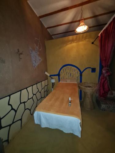 Postel nebo postele na pokoji v ubytování Riad Tigmi du Soleil