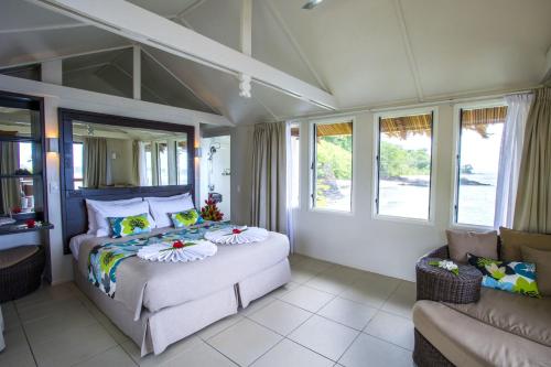 Postel nebo postele na pokoji v ubytování Seabreeze Resort Samoa – Exclusively for Adults