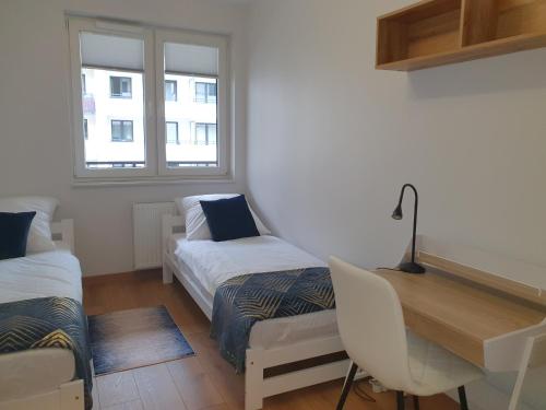 Ένα ή περισσότερα κρεβάτια σε δωμάτιο στο Apartament 45