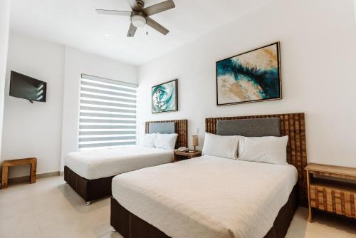 Postel nebo postele na pokoji v ubytování Loft Hotel Malecón Vallarta
