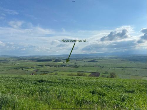 a view of a field of grass with the words moses sometimes it at L’escapade de Tali in Talizat