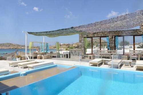 a swimming pool in a villa with a view of the ocean at Paraga View in Paraga