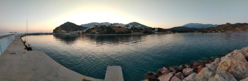 a large body of water with a town in the background at THROUBI VILLA in Agia Galini