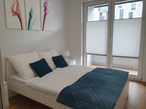 Ένα ή περισσότερα κρεβάτια σε δωμάτιο στο Apartament 45