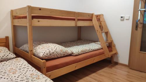 a couple of bunk beds in a room at Ubytovanie u Grošíka in Oščadnica