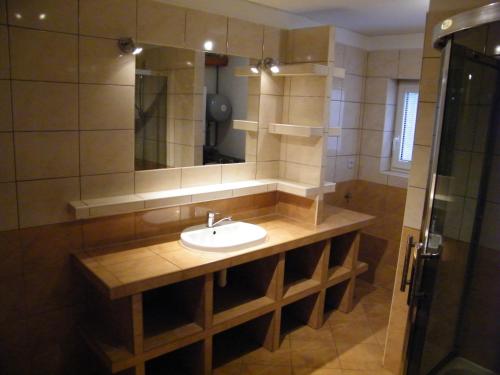 a bathroom with a sink and a mirror at Ubytovanie u Grošíka in Oščadnica