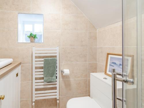 a bathroom with a toilet and a shower at Priests Abode - Uk40759 in Barrow upon Humber