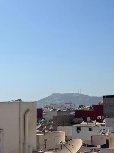 a view of a city with buildings and a skateboard at Appartement Gold moderne avec hammam centre ville in Agadir