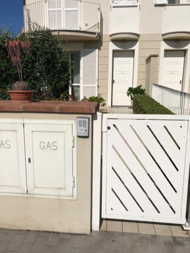 a white garage door in front of a house at Casa Marisa in Ponsacco