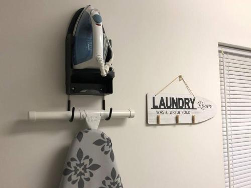 a tie hanging on a wall with a hanging sign at 1 mi to Dollywood mins to all attractions & GSMNP in Sevierville