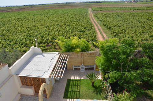 an aerial view of a house in front of a field at GIARDINO del MARE in Petrosino