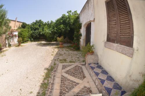an outside of a building with a window and a courtyard at GIARDINO del MARE in Petrosino