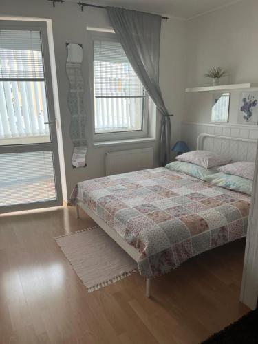 A bed or beds in a room at Apartment Sofia with terrace & parking