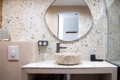 a bathroom with a sink and a mirror at Endoume Notre Dame de la Garde T2 avec PARKING in Marseille