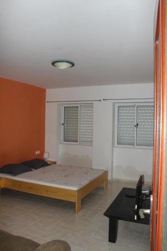 מיטה או מיטות בחדר ב-SAM House