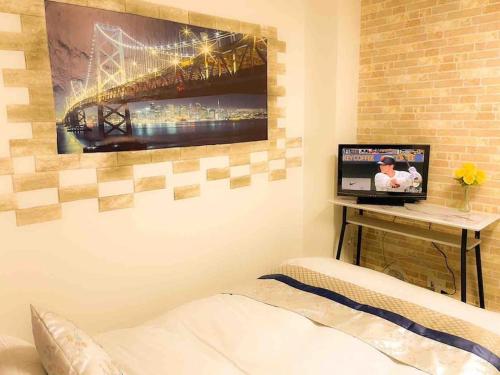 Tempat tidur dalam kamar di 203 Oshiage sta 3mins walk! Wi-Fi Elevator 4pax