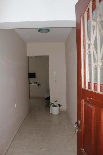 an empty hallway with a toilet in a room at SAM House in Mindelo