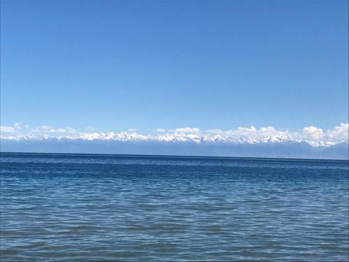 a large body of water with clouds in the sky at Берег3 in Bosteri