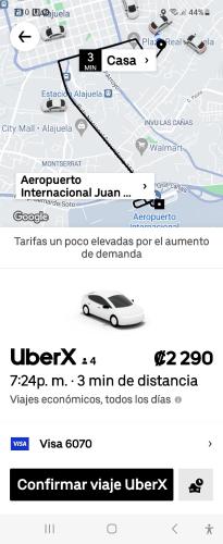 a screenshot of a cell phone with a car on a road at Don Carlos Place UPPER UNIT in Alajuela City