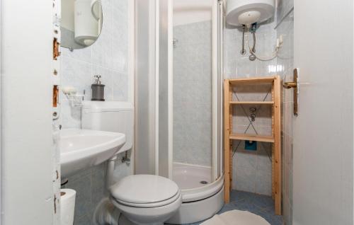 a bathroom with a toilet and a sink and a shower at Awesome Apartment In Pinezici With Wifi in Pinezici