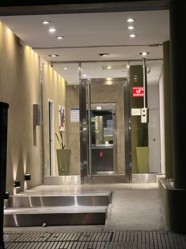 a lobby with an entrance to a building with a revolving door at Departamento en Recoleta in Buenos Aires