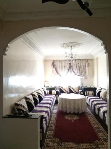 a room with couches and a table and a window at CasaCalma in Casablanca
