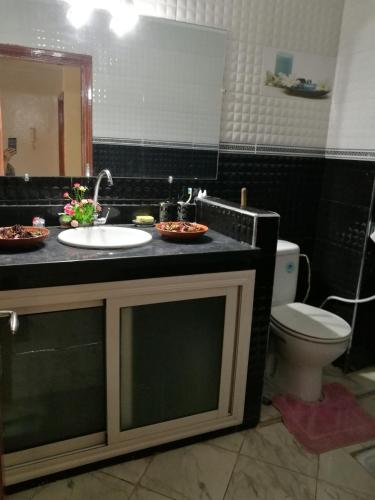 a bathroom with a sink and a toilet at CasaCalma in Casablanca