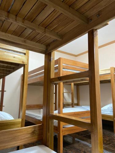 a group of bunk beds in a hostel at Eden Travellers Lodge in Puerto Princesa City