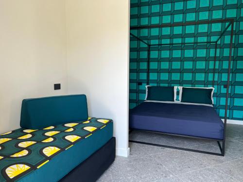 a bedroom with a bed and a chair in it at 1912 Relais - Sorrento Coast in Piano di Sorrento
