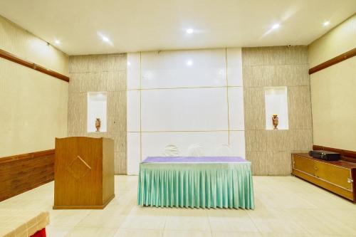 a large room with a table and a podium at HOTEL WINDSOR CASTLE in Salem