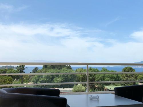 a view from the balcony of a house at Bella Vista Hôtel, Suites & Maisons in Porticcio