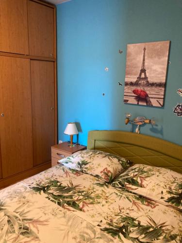 a bedroom with a bed and the eiffel tower at Apartment Jasna B in Omišalj