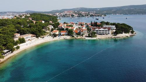 an aerial view of a small island in the water at Kopara apartmanok in Rogoznica