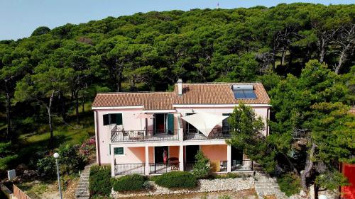 an aerial view of a house on a hill at Kopara apartmanok in Rogoznica