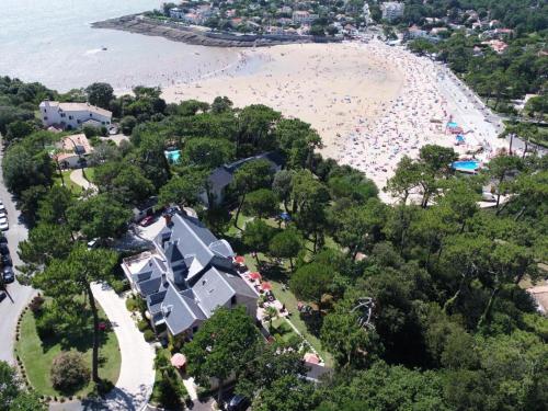 an aerial view of a resort with a beach at Hôtel The Originals Résidence de Rohan (EX RELAIS DU SILENCE) in Vaux-sur-Mer