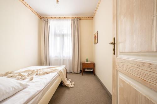 a bedroom with a bed and a window at Willa Bór in Zakopane