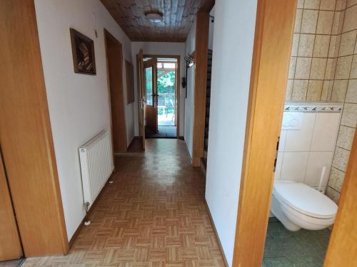 a hallway with a toilet in a house at Chalet in Fügen near Spieljochbahn in Fügen