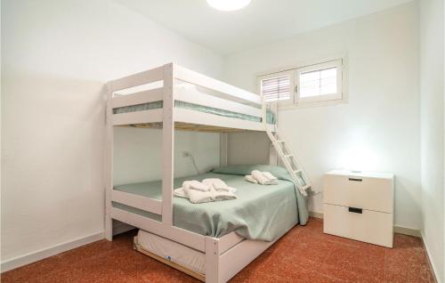 a bedroom with a bunk bed with a ladder at Beautiful Apartment In Cabo De Gata With 2 Bedrooms And Outdoor Swimming Pool in El Cabo de Gata