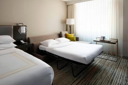 a hotel room with two beds and a window at Marriott Columbus Northwest in Dublin